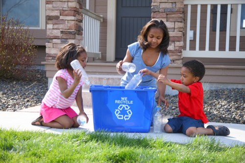 Construction workers managing waste disposal
